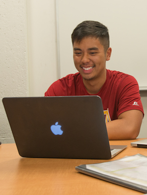 young male student at computer