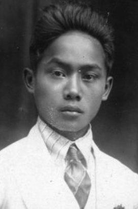 A black and white photo of a young man.
