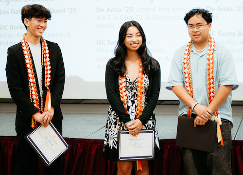 three students with certificates and colored sashes