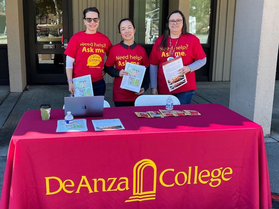 staff at Caring Campus table